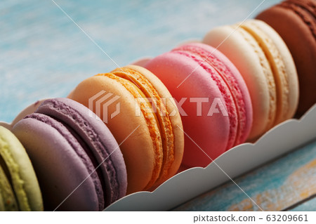 Macaroni cookies of different colors in a box, on Macaroni cookies of different colors in a box, on 63209661