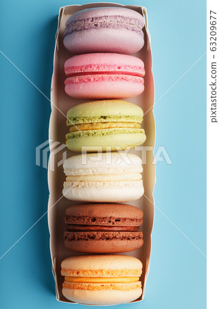 Macaroni cookies of different colors in a white 63209677