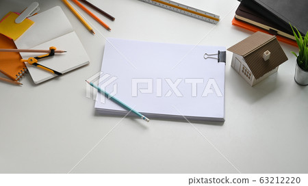 Photo of Architect working table with accessories putting on it. Flat lay Model house. Photo of Architect working table with accessories putting on it. Flat lay Model house. 63212220