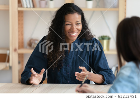 Smiling african american job seeker feeling relaxed on interview. 63212451