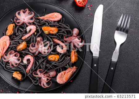 Black seafood pasta with shrimp and octopus 63213571