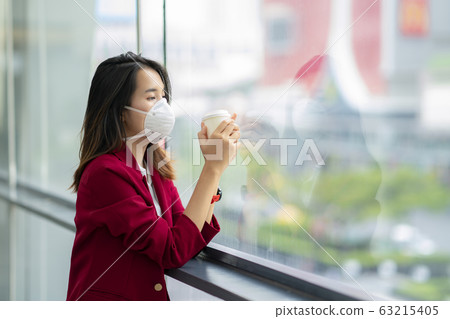 Asian girl use a protection mask for prevent PM 63215405