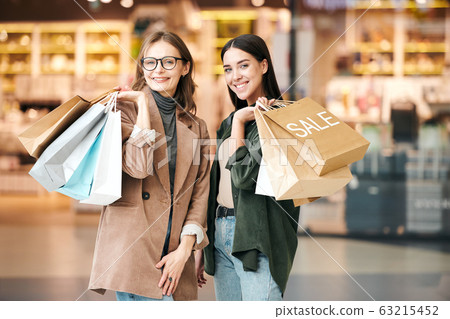 Happy women after good shopping Happy women after good shopping 63215452