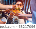Group of Asian people celebrating at rooftop party together, night lifestyle with light flare 63217096