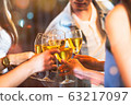 Group of Asian people celebrating at rooftop party together, night lifestyle with light flare 63217097