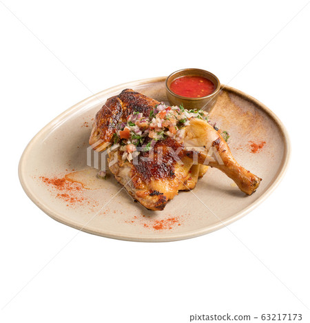 half of appetizing grilled juicy chicken with golden brown crust with and salad on a plate, on plate half of appetizing grilled juicy chicken with golden brown crust with and salad on a plate, on plate 63217173