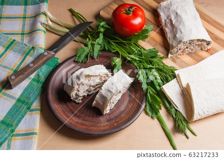 Two pieces of pita bread or lavash roll with Two pieces of pita bread or lavash roll with 63217233
