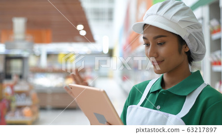 Shopping concepts. The young woman is working 63217897