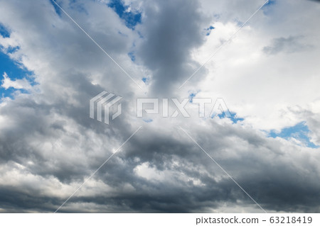 Blue sky with clouds natural background. Blue sky with clouds natural background. 63218419