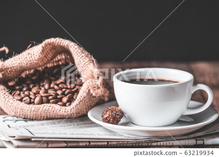 Coffee cup,cinnamon stick,roasted coffee beans and 63219934
