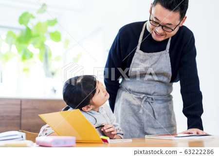 Girls doing their homework 63222286