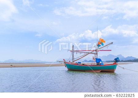 Fishing boat on beach near fisherman village at 63222825