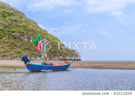 Fishing boat on beach near fisherman village at 63222859
