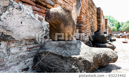 Buddha statue in an old temple and traces of decay 63223442