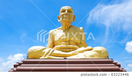 The large yellow buddha statue in the sky 63223446
