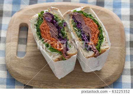 Colorful volume sandwich with roast beef and vegetables Colorful volume sandwich with roast beef and vegetables 63225352