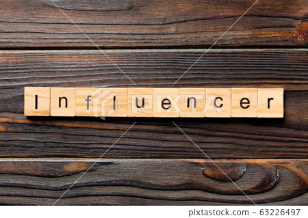 influencer word written on wood block. influencer influencer word written on wood block. influencer 63226497