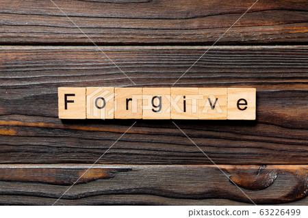 Forgive word written on wood block. Forgive text 63226499