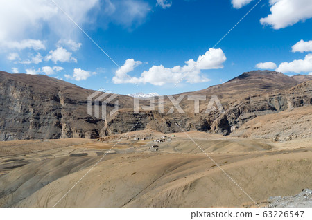 Human settlements in high altitude areas of Himalayan hills and mountains valley higher altitudes region extreme cold climate.  63226547