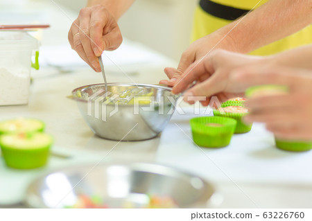 The process of making cupcakes. Creation of cakes 63226760