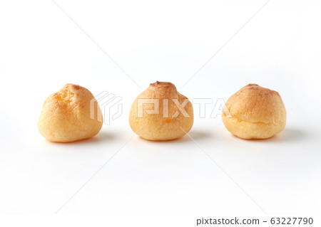 Side by side cream puffs french sweets white background Side by side cream puffs french sweets white background 63227790