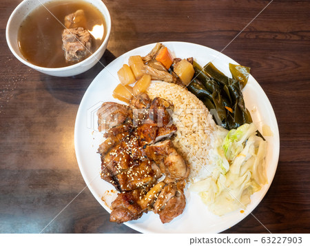rice with grilled chicken on wood table rice with grilled chicken on wood table 63227903