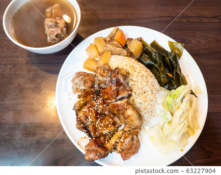 rice with grilled chicken on wood table rice with grilled chicken on wood table 63227904