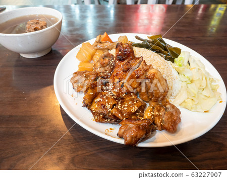 rice with grilled chicken on wood table rice with grilled chicken on wood table 63227907