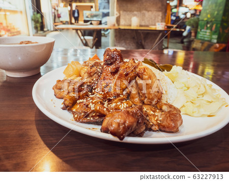 rice with grilled chicken on wood table rice with grilled chicken on wood table 63227913