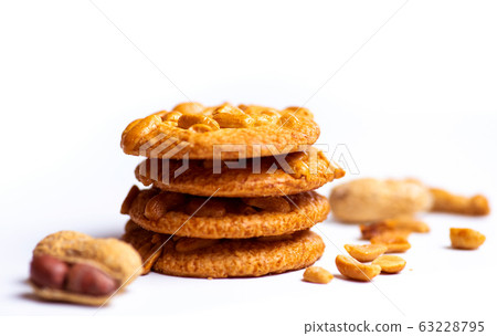Group of cookies with peanuts on mat. 63228795
