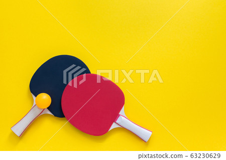 Red and black tennis ping pong rackets isolated 63230629