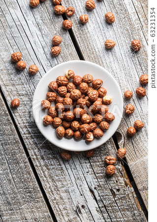 Hazelnuts with sugar icing. 63231354