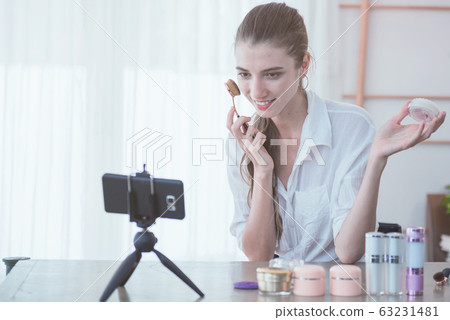 Smart beauty blogger making a video for her beauty Smart beauty blogger making a video for her beauty 63231481