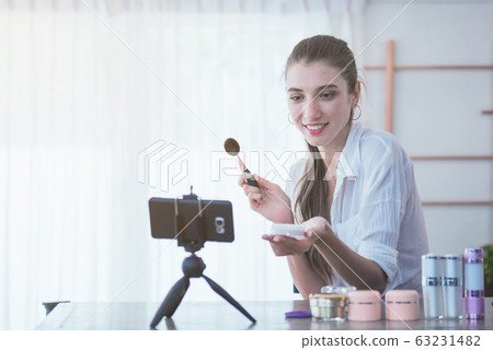 Young girl blogger making a video for her beauty Young girl blogger making a video for her beauty 63231482