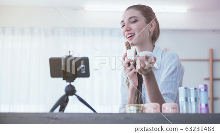 Young beauty blogger making a video for her beauty Young beauty blogger making a video for her beauty 63231483