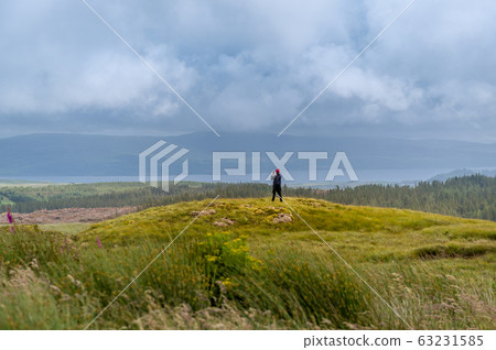 Tourist making photo of scenic Island of Mull landscape 63231585