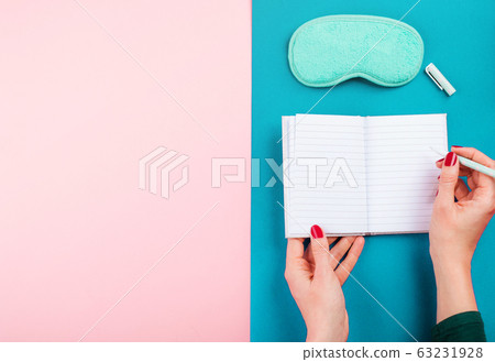 Sleeping mask and open page of sleep journal 63231928