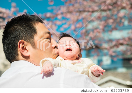 Baby and cherry blossom Baby and cherry blossom 63235789