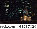 Night View of Lau Pa Sat Food Court in the middle of modern office buildings in Singapore 63237820