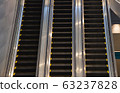 Escalators in subway train station towards upper levels 63237828