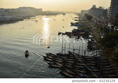 Dhaka, Bangladesh Beautiful Asahi and cityscape Many small boats that stop on the Brigonga River A ferry that goes along the river 63238129