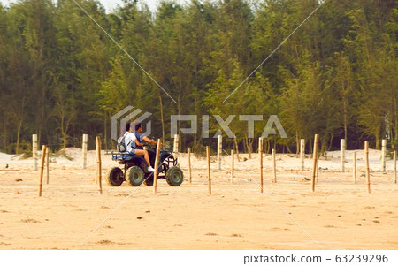 Honeymoon couple riding Motorized tricycle  63239296