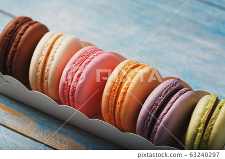 Macaroni cookies of different colors in a box on a Macaroni cookies of different colors in a box on a 63240297