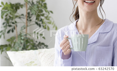 Woman getting up Woman getting up 63242570