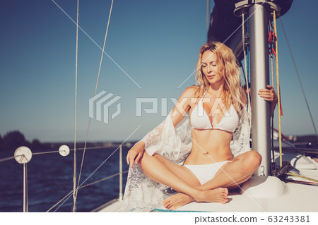 beautiful woman with a slim figure against the sky beautiful woman with a slim figure against the sky 63243381