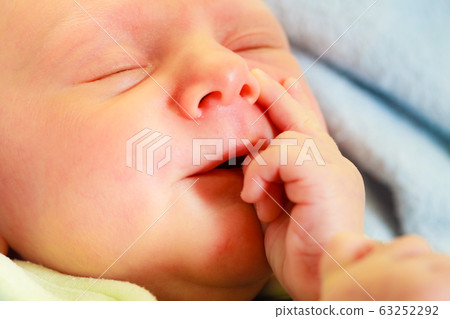Little newborn baby sleeping in pajamas Little newborn baby sleeping in pajamas 63252292
