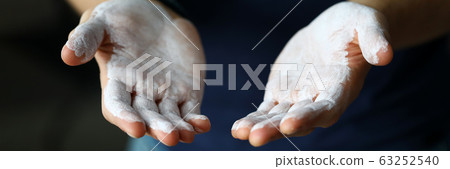Male hands smeared with magnesium powder ready to workout Male hands smeared with magnesium powder ready to workout 63252540