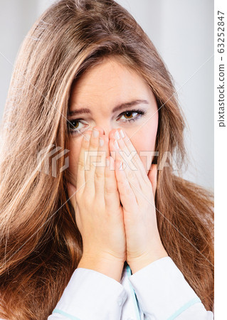 Sad woman cover face with hands Sad woman cover face with hands 63252847