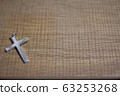 Cross placed on wooden desk 63253268