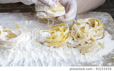 several twisted long pasta several twisted long pasta 63253439